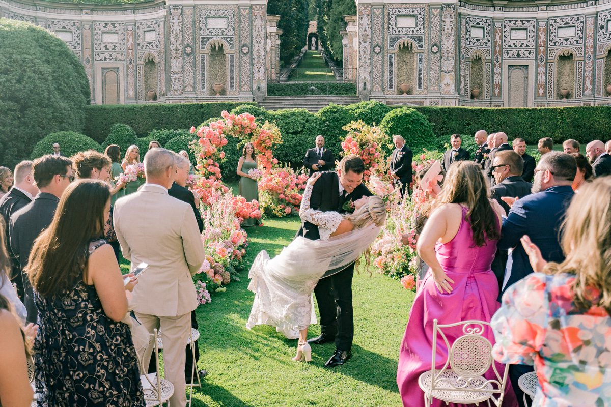 Bride and groom sharing a kiss in the gardens of Villa d’Este, Lake Como wedding.
