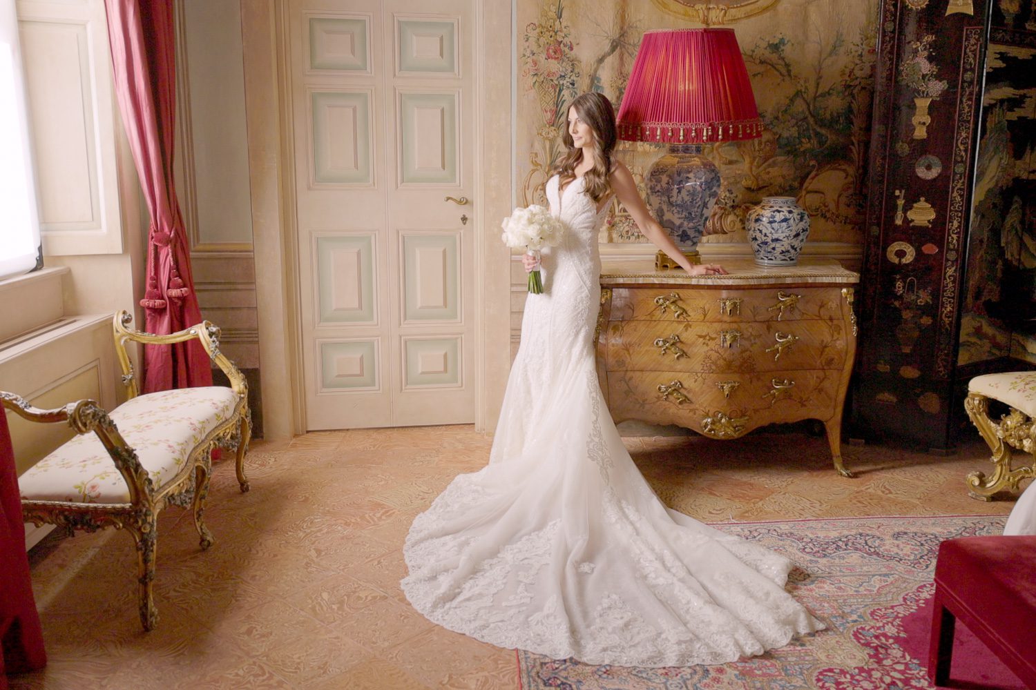 Bride standing in an ornate room inside Villa Balbiano on Lake Como — captured by Koman Studio, fine-art wedding photographers and filmmakers in Italy.