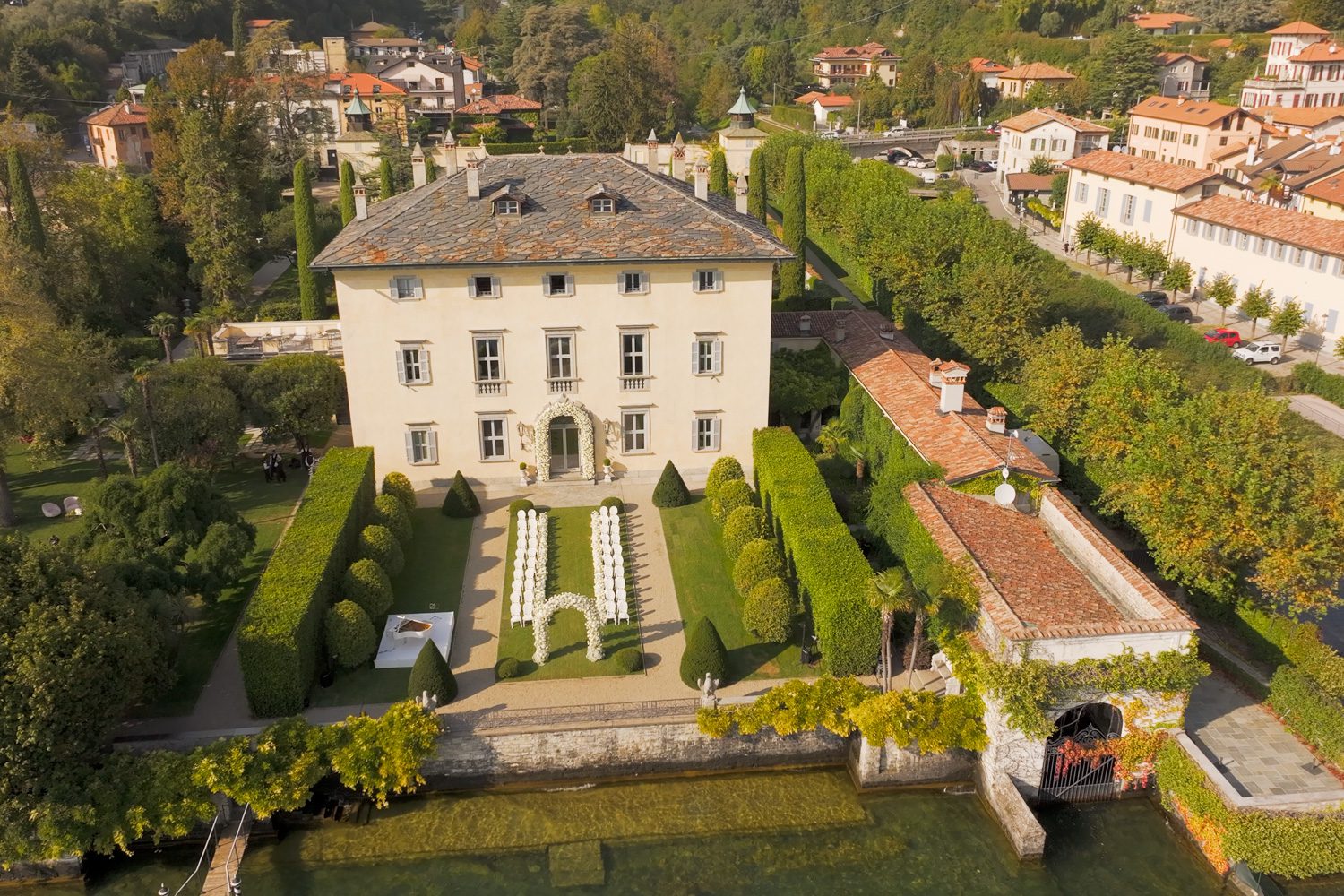 Bride and groom exchange vows beside the lake at Villa Balbiano in Lake Como, Italy — captured by Koman Studio, fine-art wedding photographers based in Tuscany and Lake Como.