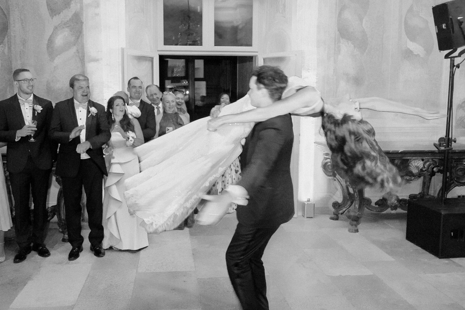 Bride and groom share their first dance during an evening reception at Villa Balbiano on Lake Como — captured by Koman Studio, fine-art wedding photographers in Italy.