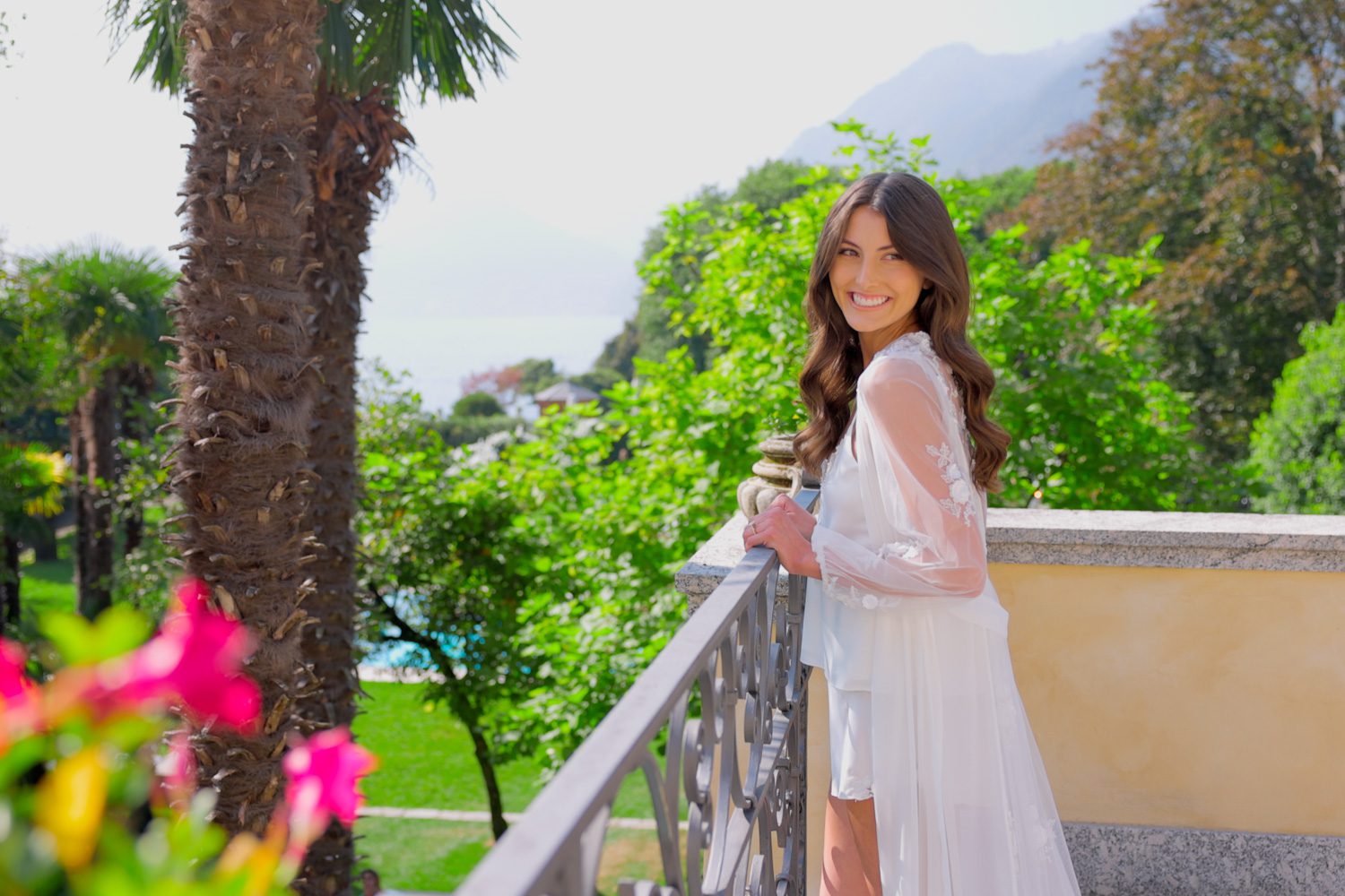 Bride in a silk robe getting ready at Villa Balbiano, Lake Como – captured by Koman Studio, fine-art wedding photographers based in Tuscany and Lake Como.