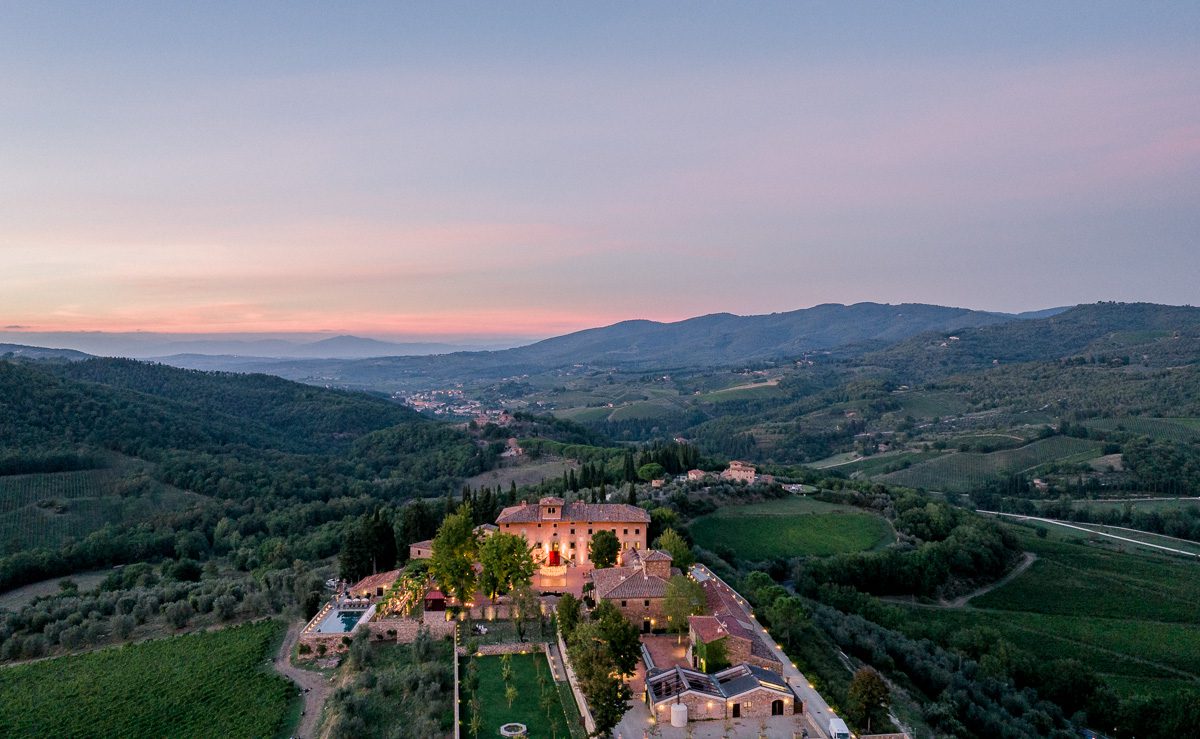 Aerial sunset view of Borgo di Vignamaggio in Chianti, Tuscany surrounded by vineyards
