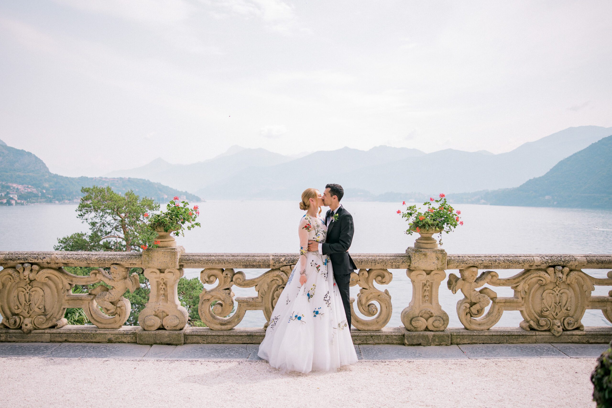 Couple embracing under the arches at Villa del Balbianello during a Lake Como engagement session